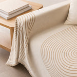 Armrest drape and brush fringe detail of the arch lines couch cover