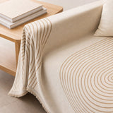 Armrest drape and brush fringe detail of the arch lines couch cover
