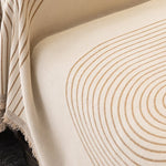 Close-up of the woven tan arch lines on the cream chenille jacquard