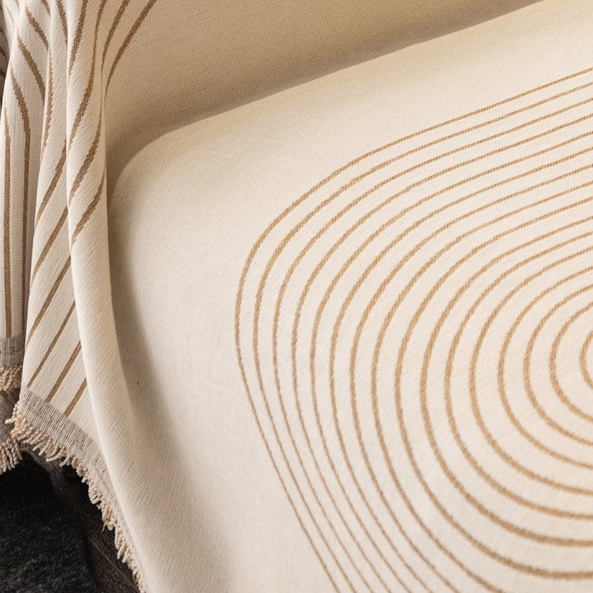 Close-up of the woven tan arch lines on the cream chenille jacquard