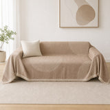 The warm tan reverse face of the arch lines cover styled on a loveseat