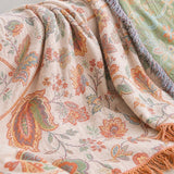 Close-up of the floral throw over the sofa back and armrest