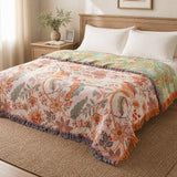 Reversible boho floral blanket spread on a queen bed