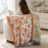 The blanket worn over the shoulders showing the reverse side