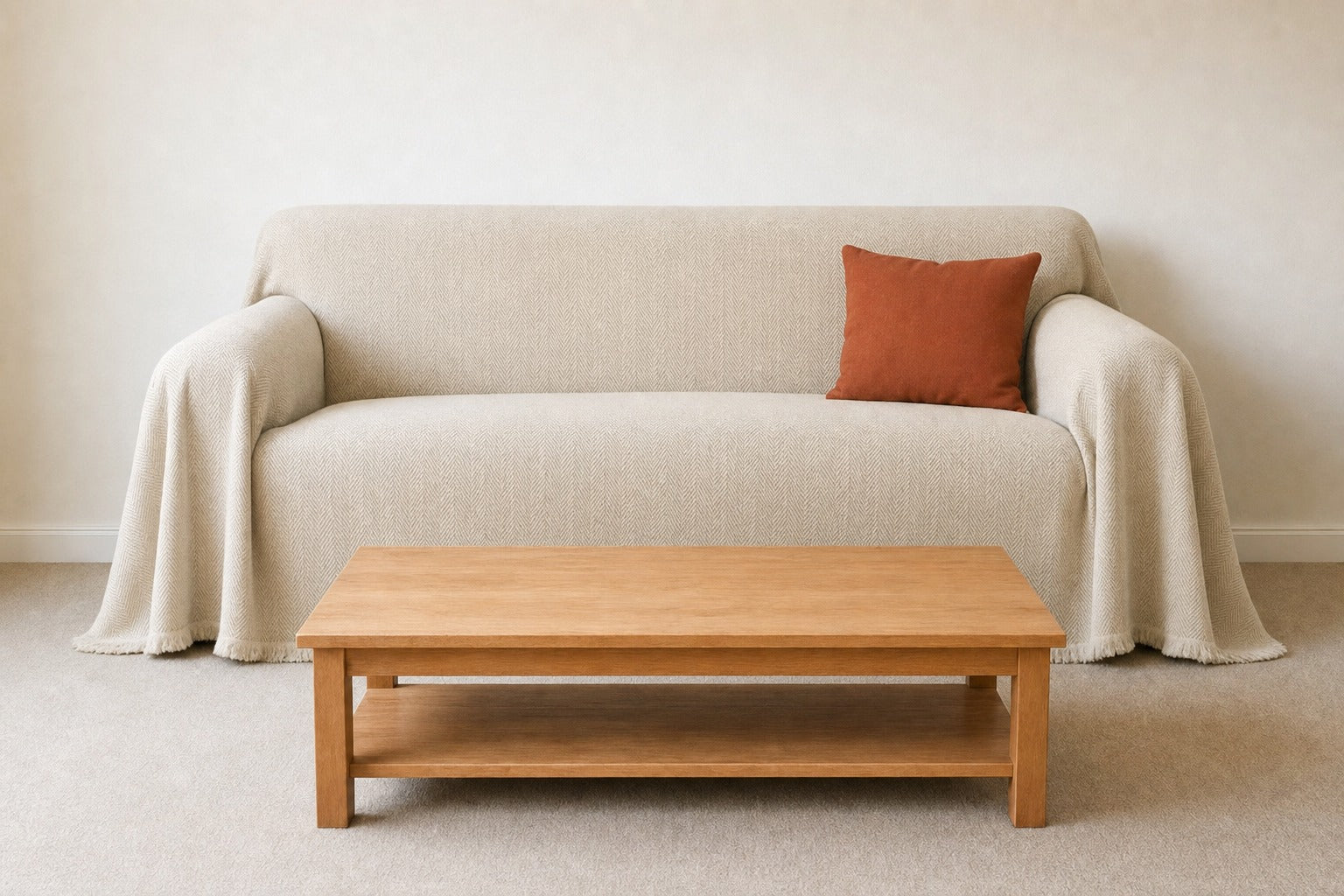 Living room couch dressed in the ivory cream herringbone cover