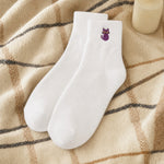 Black cat sock styled, white