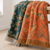 Marigold throw blanket showing both reversible faces draped