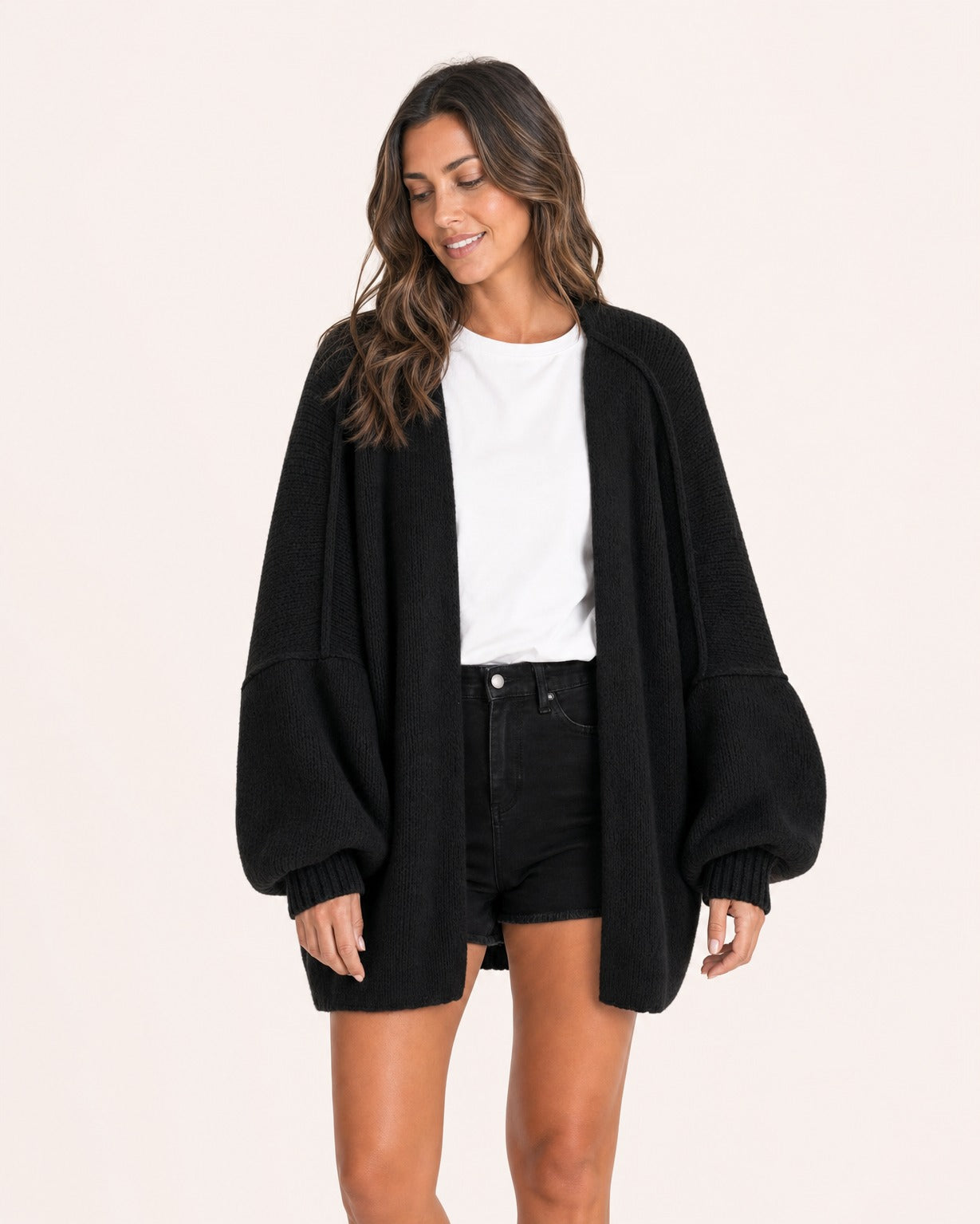 Black oversized open-front knit cardigan, front view on model :: The model is 5'6" and wears a size M