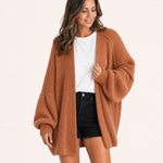 Rust oversized open-front knit cardigan, front view on model :: The model is 5'6" and wears a size M