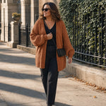 Curvy woman wearing the rust cardigan in size XL on a city sidewalk :: The model is 5'8" and wears a size XL